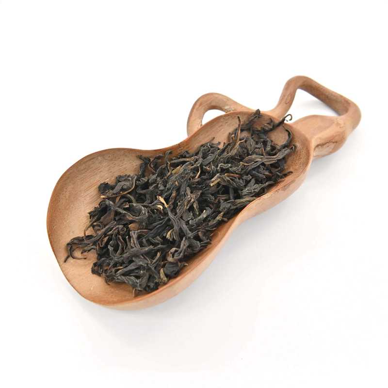 Golden Osmanthus Tieguanyin (Roasted) in a scoop